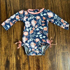Ruffle Butts Navy Floral Long Sleeve Rashguard with Coral Accents